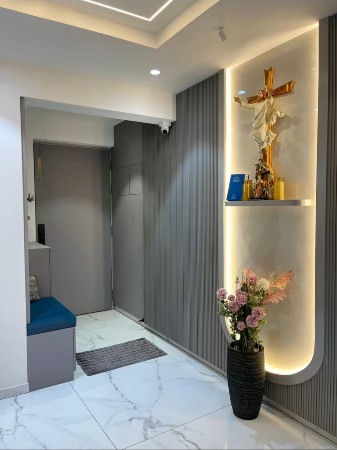 Entryway with backlit prayer niche, Mangalore residence
